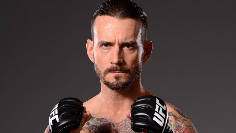032615-UFC-Phil-CM-Punk-Brooks-poses-for